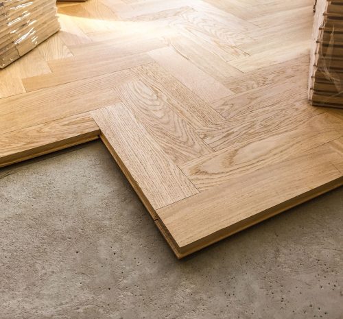 closeup-view-of-wooden-parquet-flooring-being-laid-2022-03-05-22-18-03-utc