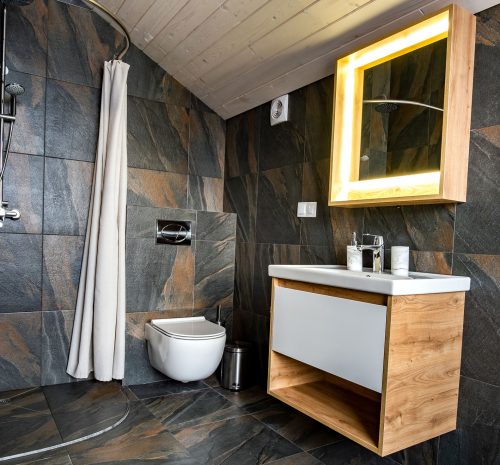 interior-of-modern-stylish-bathroom-with-black-til-2022-04-07-00-12-00-utc